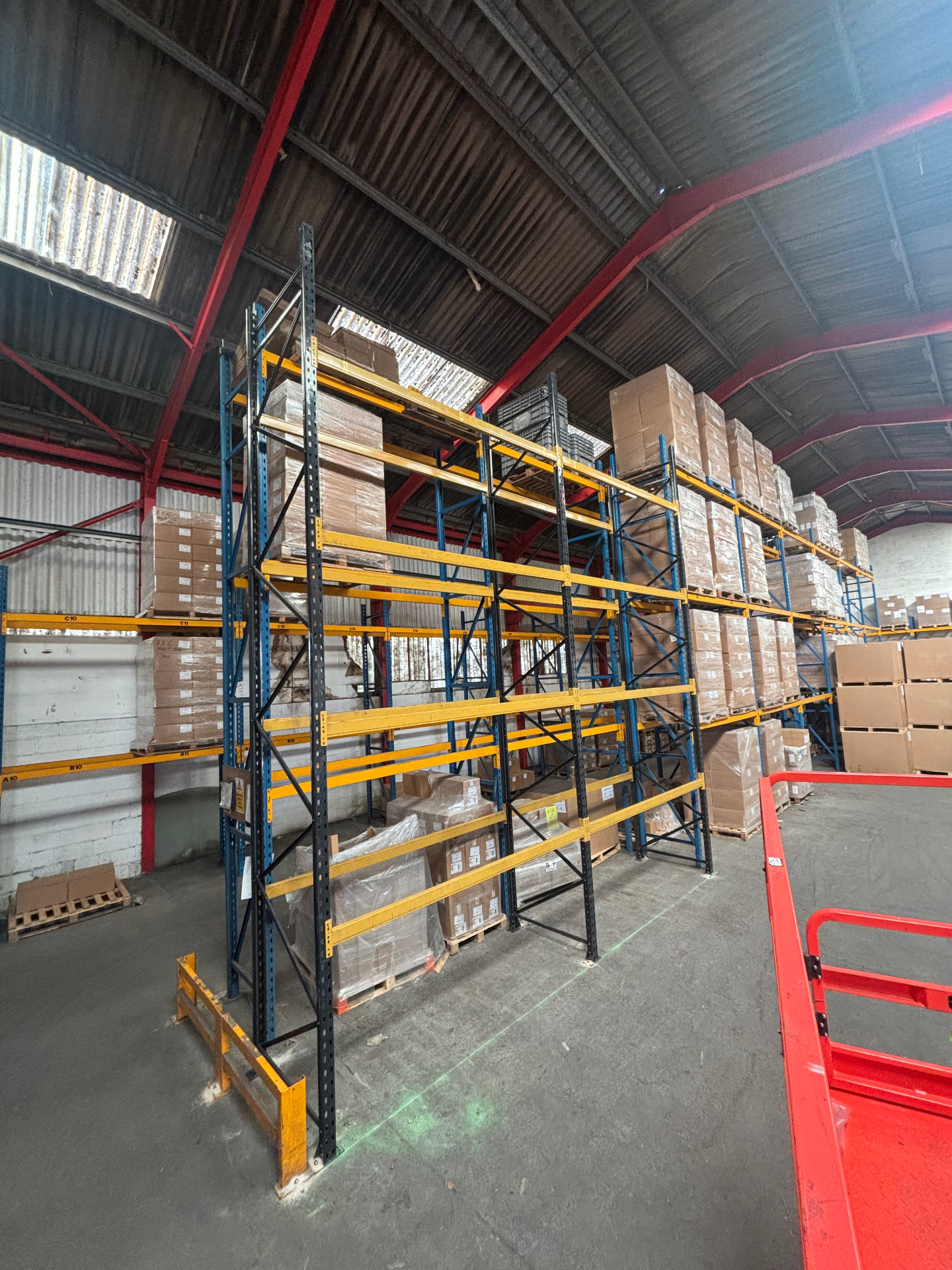 Used Pallet Racking Installation - Loaded multi-level racking with pallet stock | UM Storage Systems