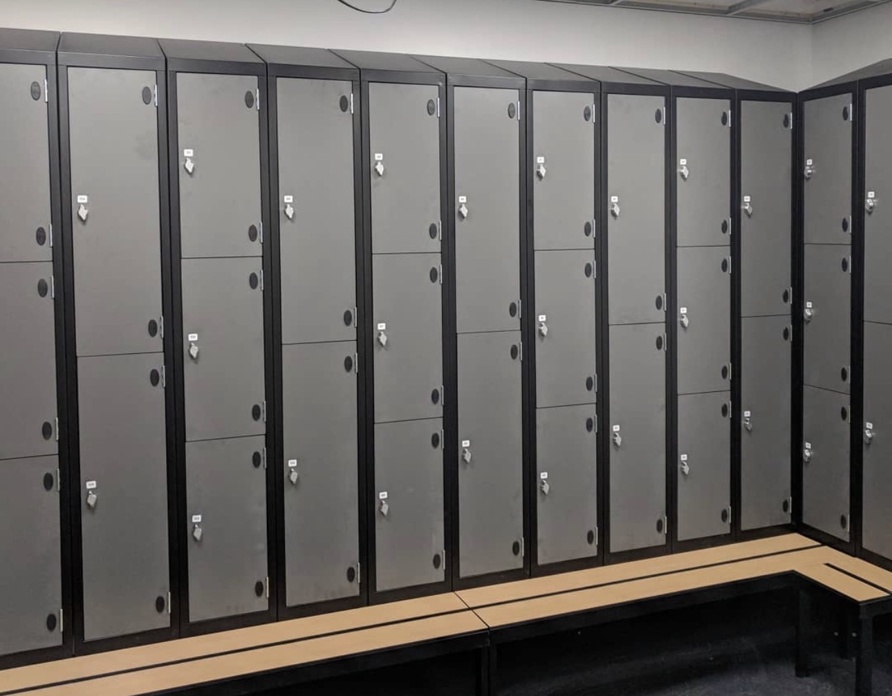 Steel locker installation with integrated bench seating | UM Storage Systems